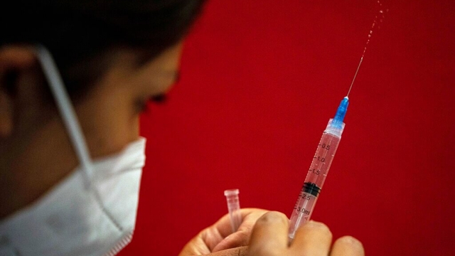 A healthcare worker prepares a dose of the Pfizer vaccine.