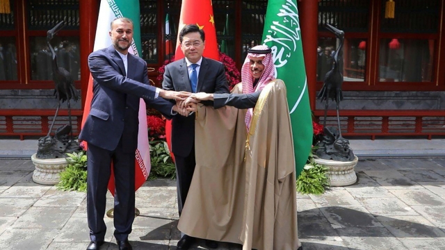 Iran's Hossein Amirabdollahian with Saudi Arabia's Prince Faisal bin Farhan Al Saud and China's Qin Gang.