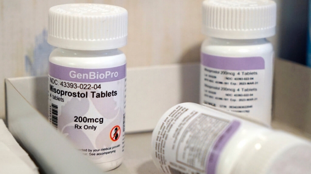 Bottles of the drug misoprostol sit on a table.