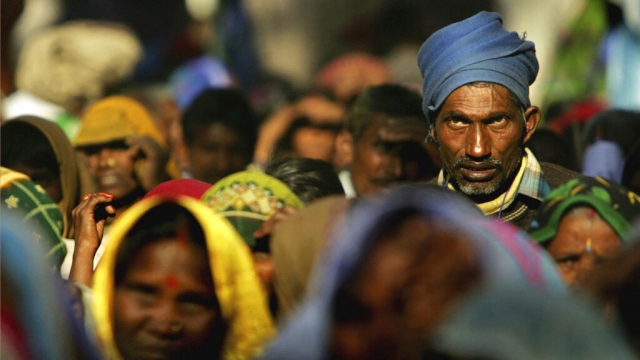 People listen to a speaker at a rally organized by National Conference of Dalit Organisations.