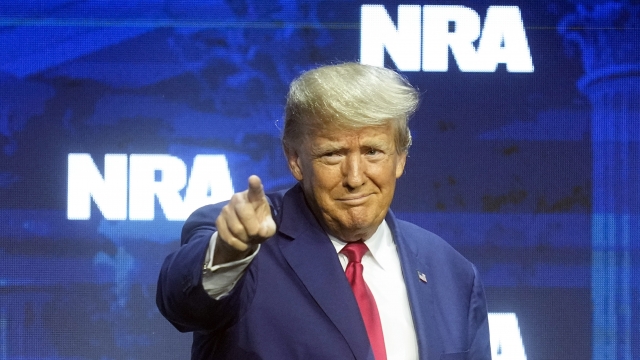 Former President Donald J. Trump reacts to the crowd before speaking at the National Rifle Association Convention