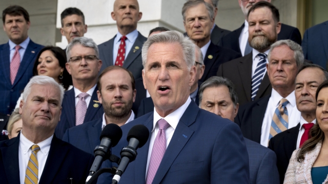 Speaker of the House Kevin McCarthy, surrounded by Republican colleagues.