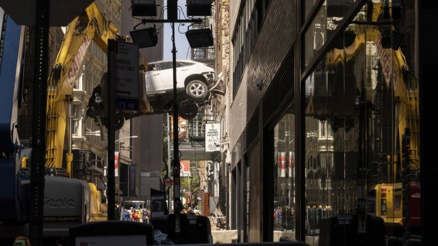 A car is removed from a partially collapsed parking garage in the Financial District of New York.