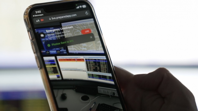 A dispatcher shows an example of a livestream app on a phone.