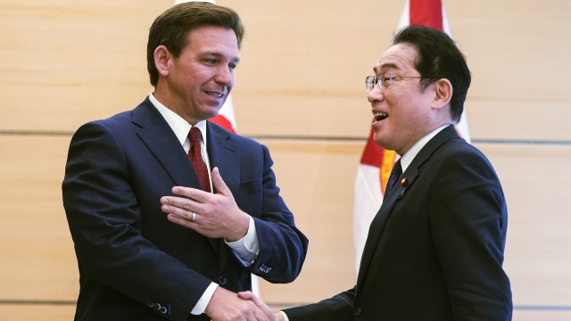 Florida Gov. Ron DeSantis shakes the hand of Japanese Prime Minister Fumio Kishida.