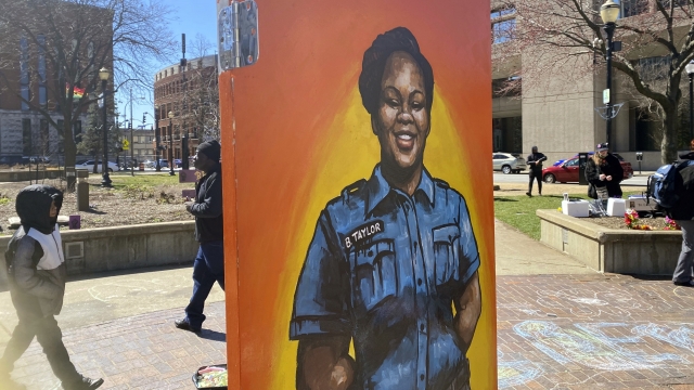 A painting of Breonna Taylor is among the art pieces decorating the center of Jefferson Square Park