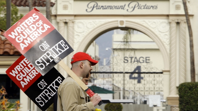 Striking film and television writers picket outside Paramount Studios.