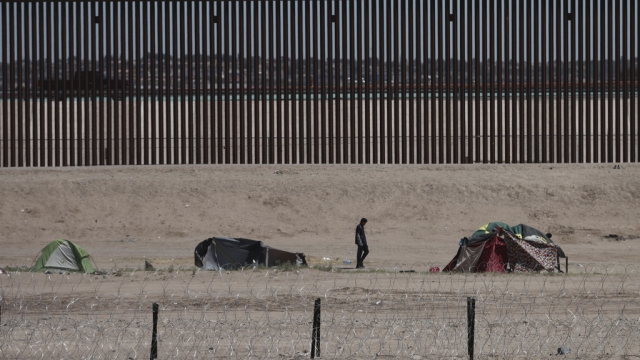 Migrants' tents stand on the riverbed on the US side of the U.S.-Mexico border in Ciudad Juárez, Mexico.