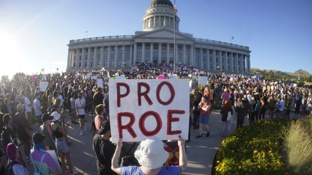 People attend an abortion-rights rally at the Utah State Capitol.