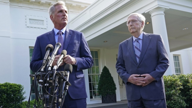 House Speaker Kevin McCarthy standing next to Senate Minority Leader Mitch McConnell.