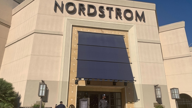 A security guard stands outside the Nordstrom store