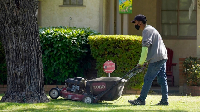 A man mowing the lawn.