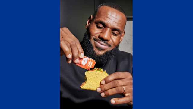 LeBron James puts hot sauce on a taco