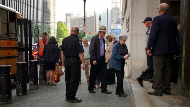 Members of Pittsburgh's Jewish community enter the Federal courthouse in Pittsburgh.