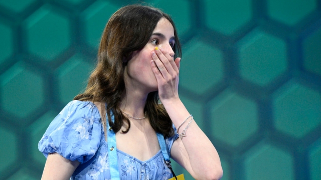 Charlotte Walsh, 14, from Arlington, Va., reacts during the Scripps National Spelling Bee