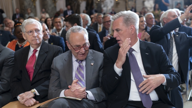 Senate Leaders Mitch McConnell and Chuck Schumer seated next to Speaker Kevin McCarthy.