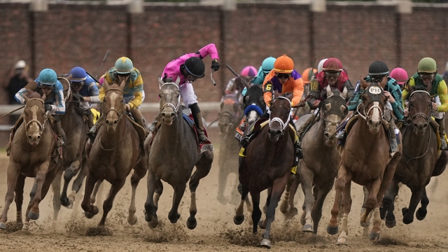 Horses round the fourth turn during the 149th running of the Kentucky Derby horse race.