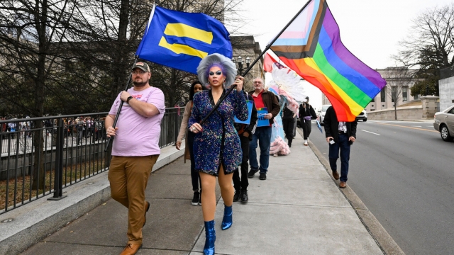 Trans rights activists march past the Tennessee state capitol.