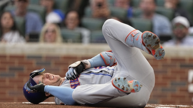 New York Mets first baseman Pete Alonso reacts after being hit.