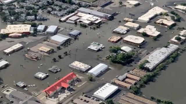 Flooding is shown from an aerial view.