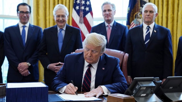 Donald Trump signing documents