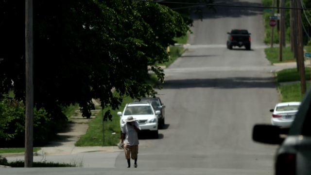 Man walks down the street in Kansas City, Missouri.