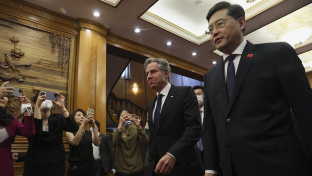 U.S. Secretary of State Antony Blinken walks with Chinese Foreign Minister Qin Gang