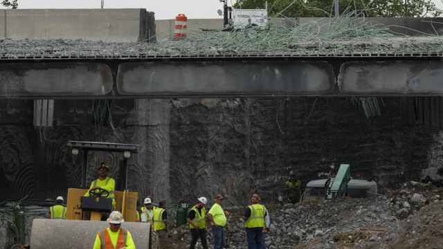 Crews work to fix a collapsed bridge.