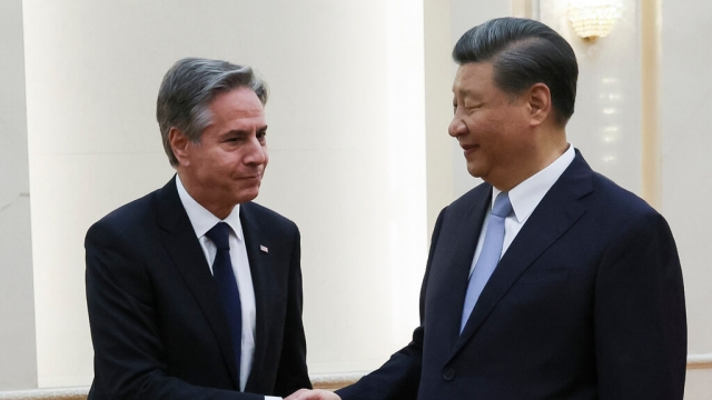 U.S. Secretary of State Antony Blinken shakes hands with Chinese President Xi Jinping