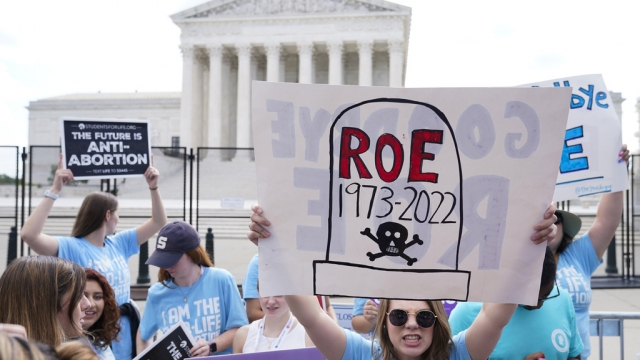 Demonstrators protest over abortion outside the U.S. Supreme Court.