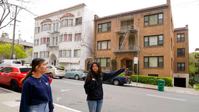 Students look for an apartment to rent