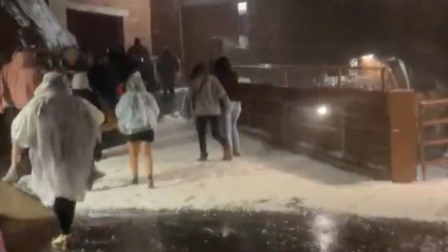 Concertgoers at Red Rocks Amphitheater in Colorado take cover from a major hail storm.