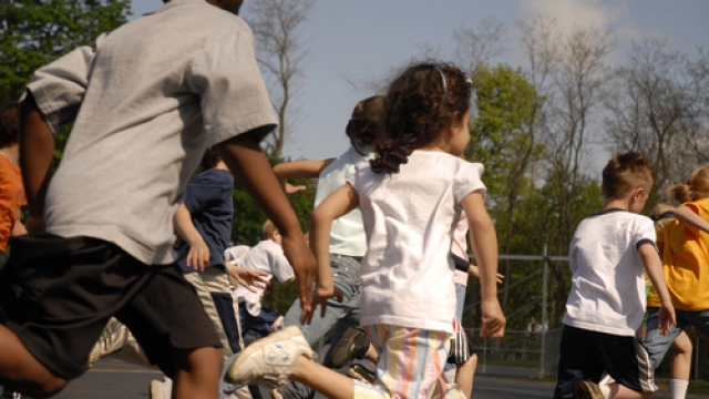 Kids running on a playground.