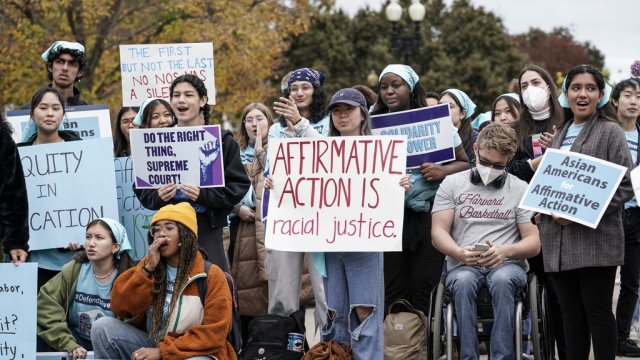 Activists demonstrate as the Supreme Court considers a college admissions affirmative action case.