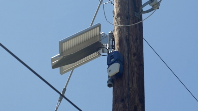 A wildfire sensor mounted on a utility pole.