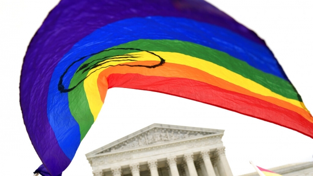 A rainbow flag displayed by protesters outside the Supreme Court.