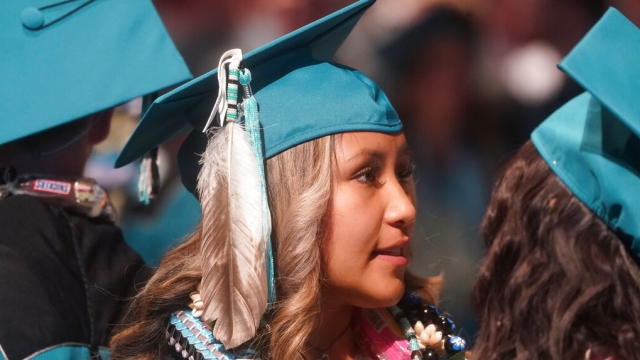 Brailyn Jake wears an eagle feather at her graduation from Cedar City High School.