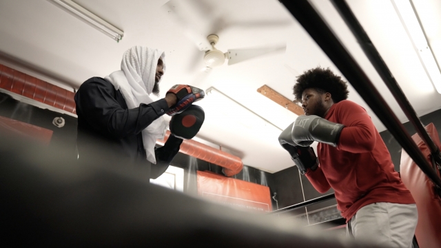 Teen training in a boxing gym.