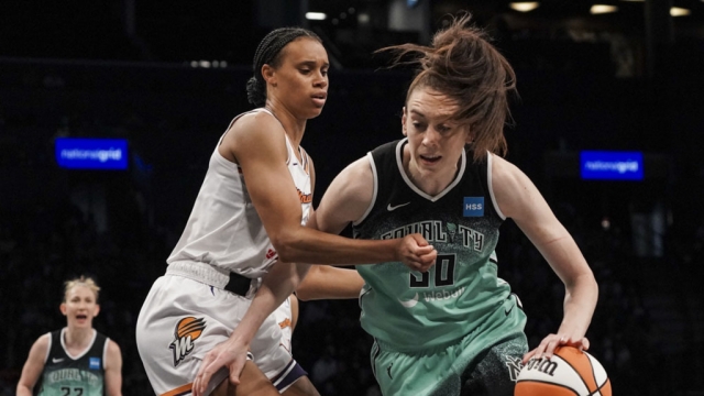 New York Liberty forward Breanna Stewart, right, drives to basket during the third quarter of a WNBA basketball game.
