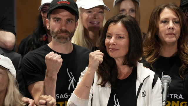 SAG-AFTRA president Fran Drescher, Ben Whitehair, and Joely Fisher attend a press conference.