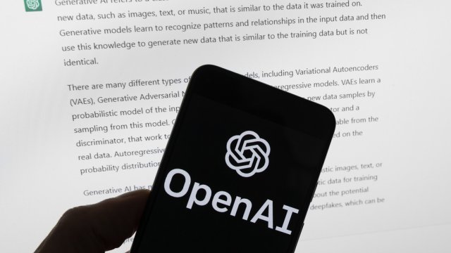 The OpenAI logo is seen on a mobile device.