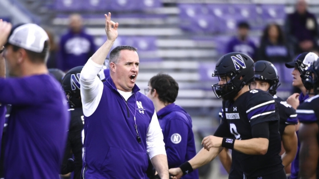 Northwestern head football coach Pat Fitzgerald directs the team before an NCAA college football game.