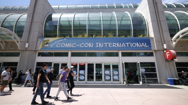 Guests walk outside the Comic-Con convention center.