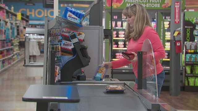 A shopper at a Williamson County Kroger uses self checkout at Kroger.