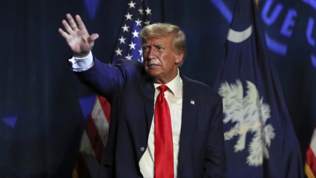 Former President Donald Trump waves.