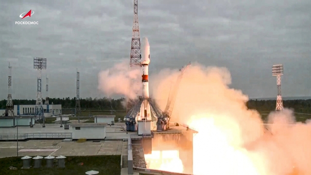 Russian rocket takes off from a launch pad.