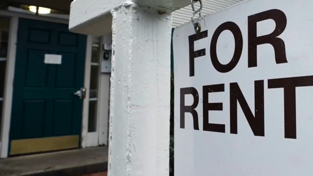 For rent sign in front of a home.