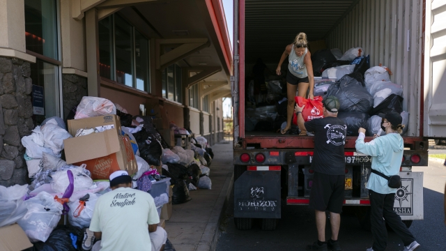 Volunteers unloading donations from a truck