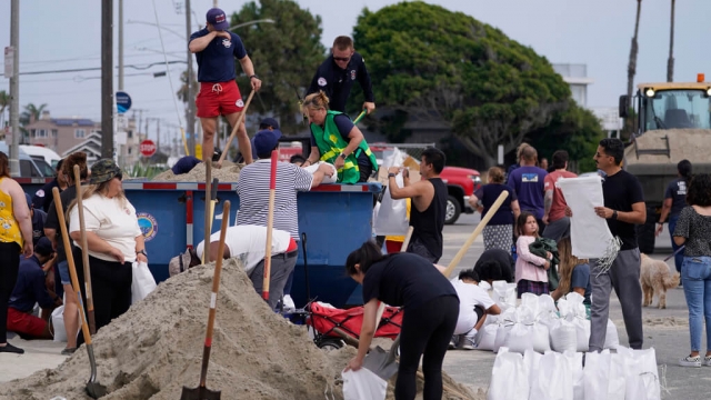 Lifeguards fill up sandbags for residents ahead of Hurricane Hilary.