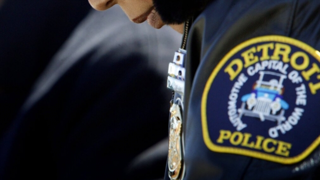 Detroit police badge displayed on an officer's jacket